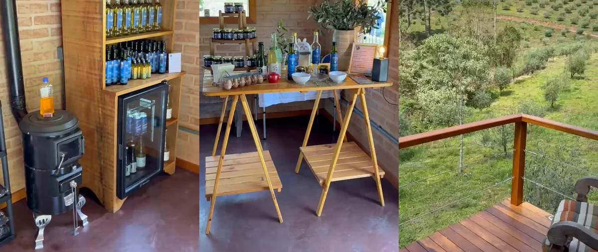 Interior do Emp&oacute;rio da Pedra: estante de azeites, mesa de produtos e deck com vista para o olival